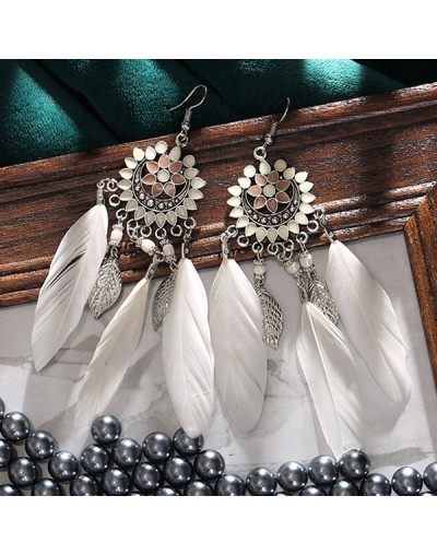 Pendientes largos de plumas con borlas y flores de sol